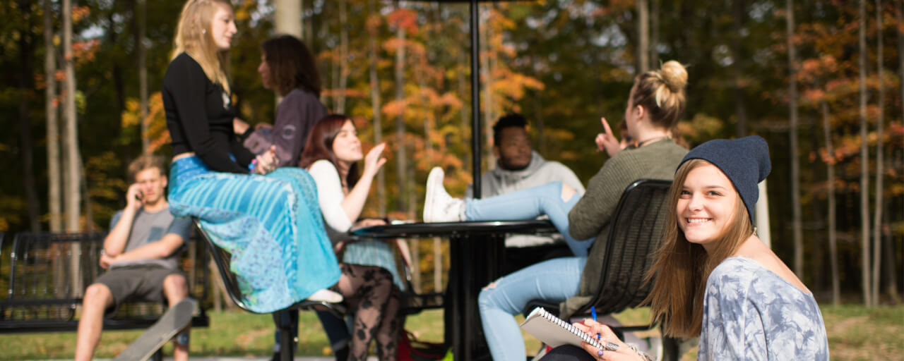 Students relaxing outside of Holton Hooker Learning and Living Center on the Allendale Campus.